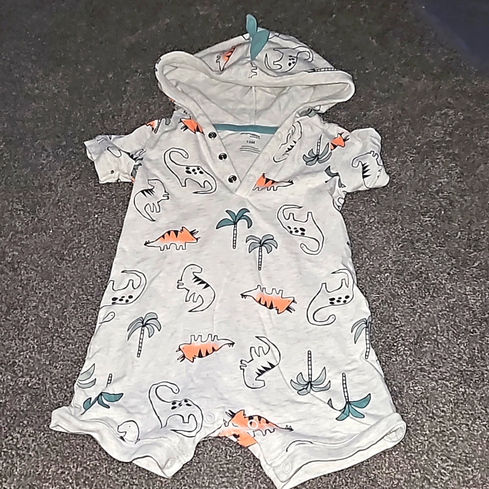 12 month short sleeved and shorts romper with hood that has spikes on it.